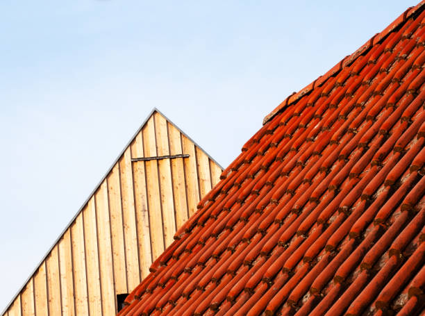 istock view alongside a tiled roof to a wooden gable 1312574680