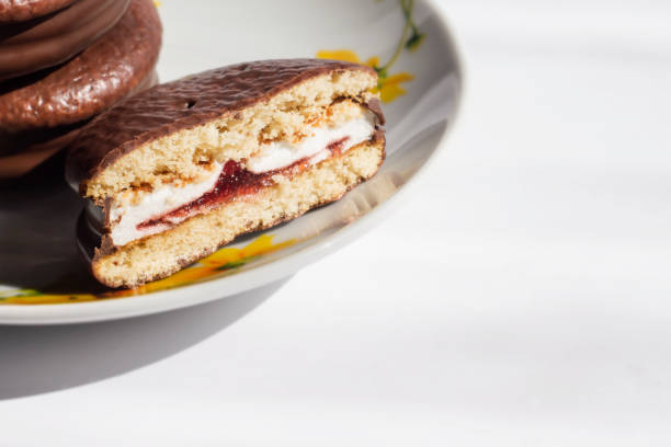 istock Chocolate chip cookies cut in half with jam. Dessert, cake. 1312579844