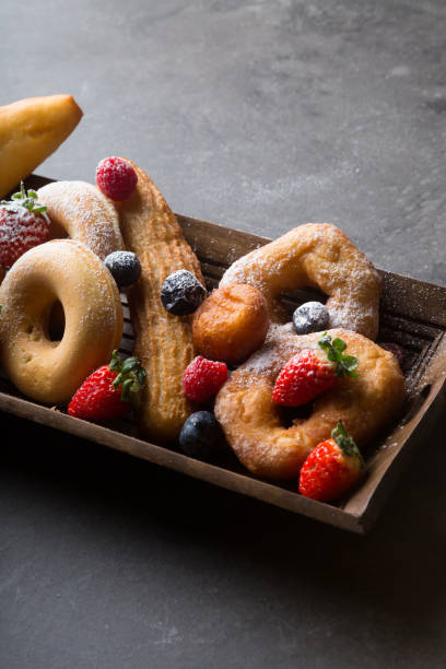 istock Different types of donuts served with berries 1312581710