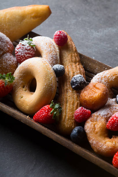 istock Different types of donuts served with berries 1312581731