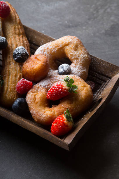istock Different types of donuts served with berries 1312581753