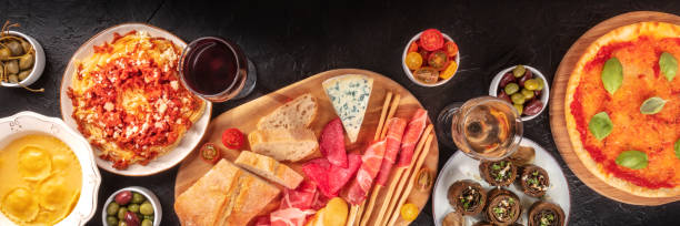istock Italian cuisine panoramic banner on a black background 1312581817
