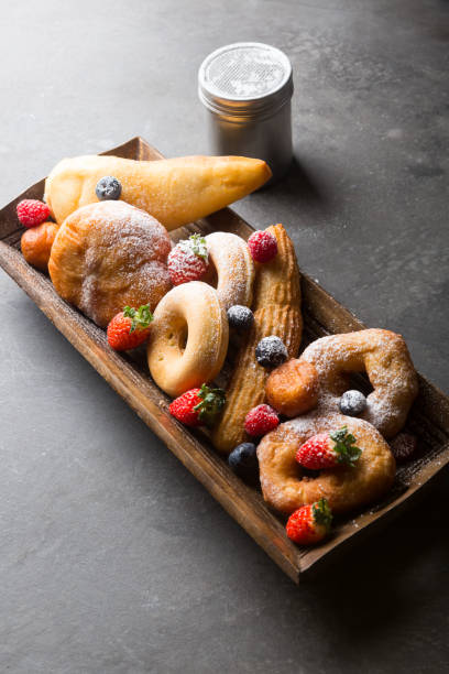 istock Different types of donuts served with berries 1312581874