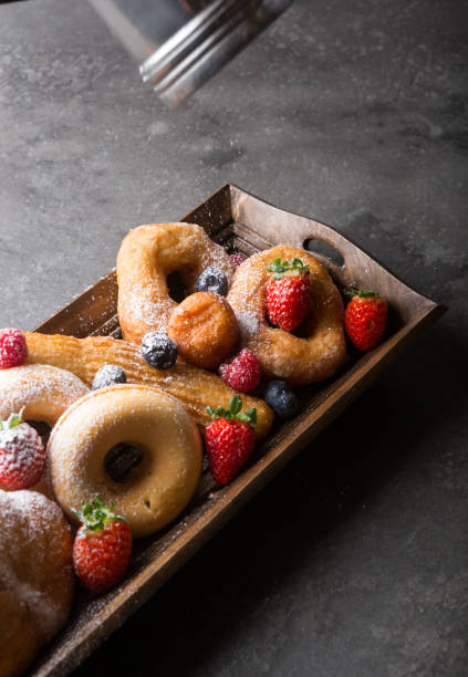 istock Different types of donuts served with berries 1312581923