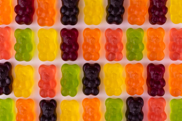 istock Bright multi-colored gummy bears. Background from jelly sweets. 1312582150