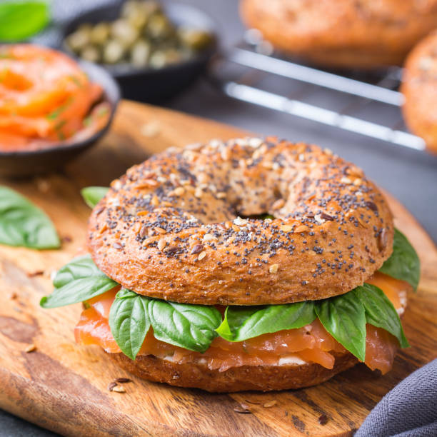 istock Bagels with cream cheese and salmon. Plating, fast lunch, meal. 1312582855