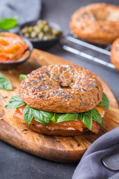istock Bagels with cream cheese and salmon. Plating, fast lunch, meal. 1312583089