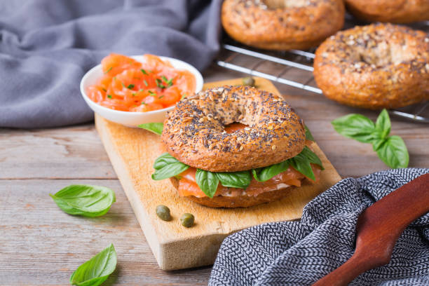 istock Bagels with cream cheese and salmon. Plating, fast lunch, meal. 1312583119