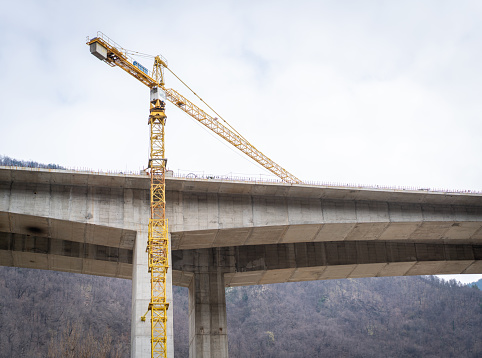 Aerial drone view of highway overpass construction site.