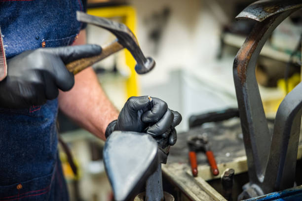 istock Hitting nail with cobbler's hammer for repairing high heel 1312587168