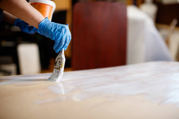 istock Painting wooden board white with paintbrush 1312587408