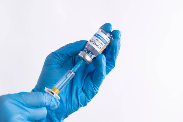 istock Doctor's hands preparing the coronavirus COVID-19 vaccine 1312592170