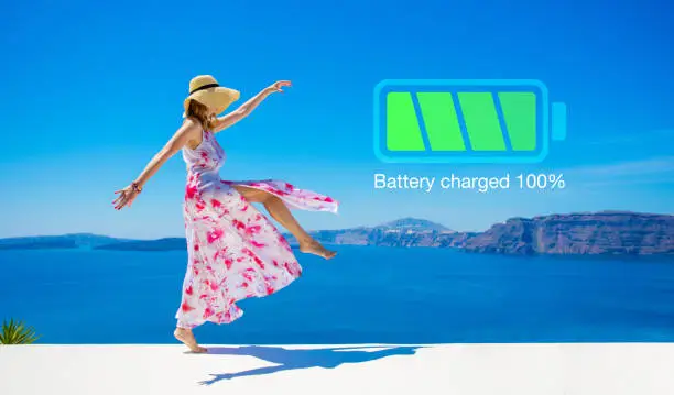 Photo of Woman with fully charged inner battery, concept of taking a break and recharging yourself