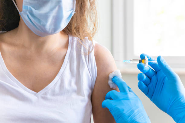 istock Doctor applying a vaccine on a woman's arm 1312593925