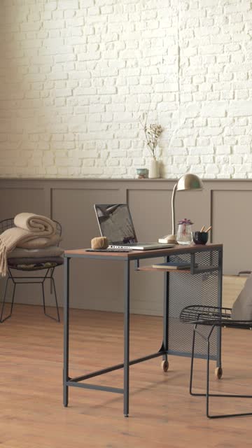modern vertical home interior office design style with white brick wall and desk computer