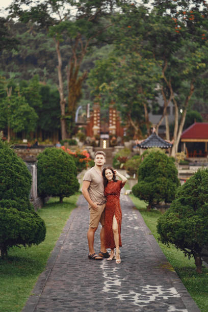 istock Couple standing on a temple background 1312595677