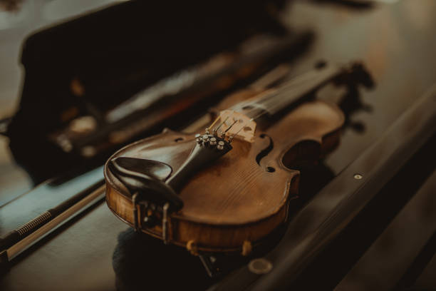 istock Close-Up Of Violin On Table 1312597889