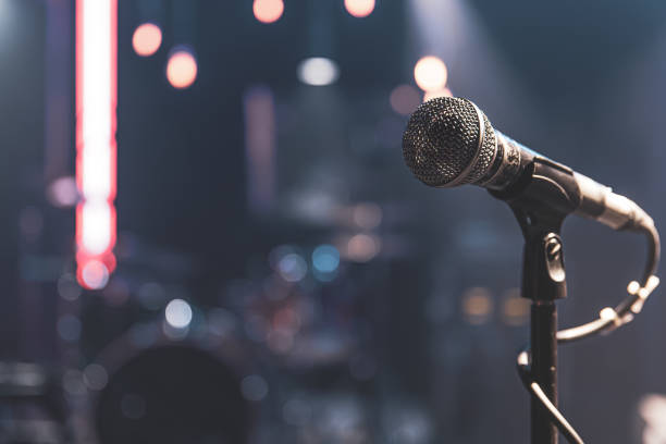istock Close up microphone on blurred background with bokeh. 1312597962
