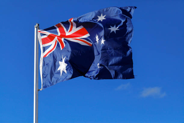 istock Australia Flag Blowing Blue Close-up Outdoors Red Star White 1312598046