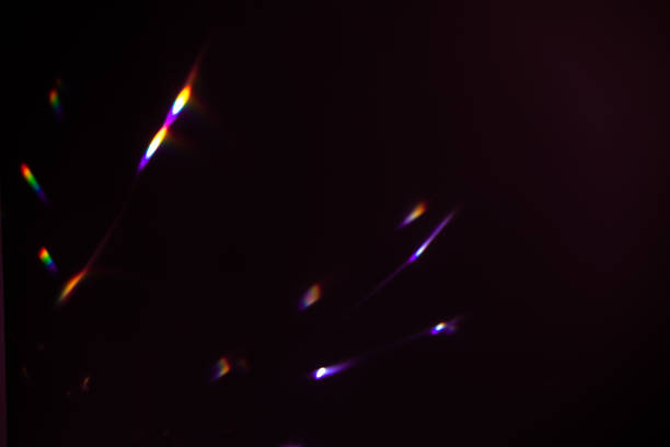 istock colorful warm rainbow crystal light leaks on black background 1312598355