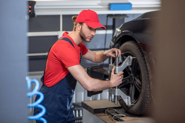istock Man working near wheel in car service 1312599284