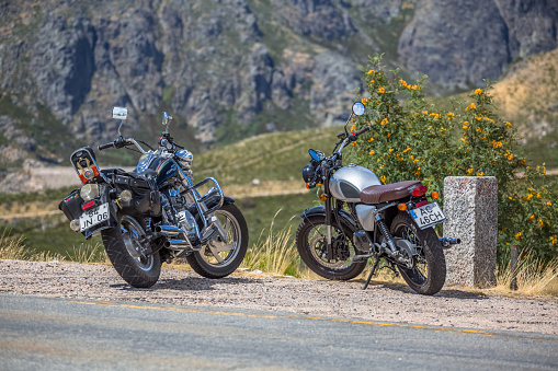 Seia / Serra da Estrela / Portugal - 08 15 2020: View of two large displacement motorcycles parked at the side of the road