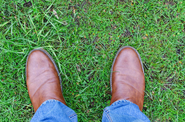 istock Man and green grass after the rain. 1312601564