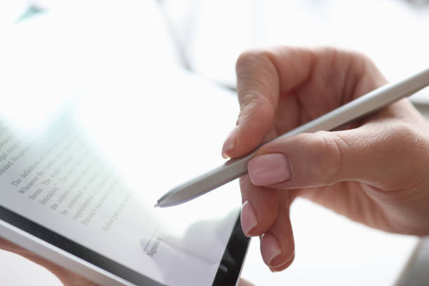 istock Female hand puts electronic signature in tablet with stylus 1312601644