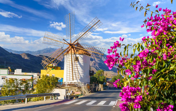 Traditional old windmill in Mogan Lanscape with traditional old windmill in Mogan village, Gran Canary, Spain grand canary stock pictures, royalty-free photos & images