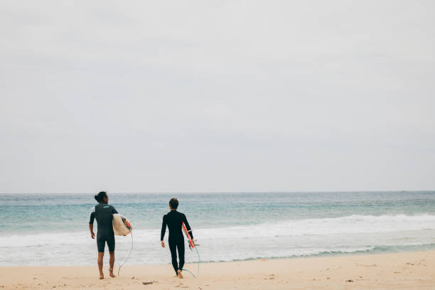 istock Go surfing with friends 1312609863