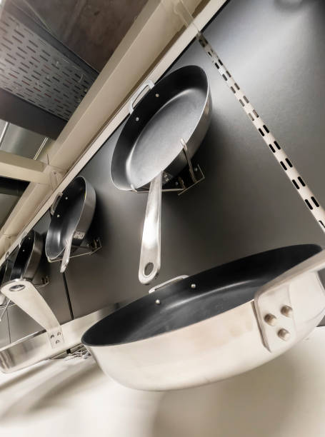 istock Frying pans on the shelf in the store 1312609894
