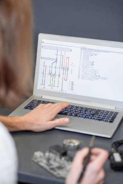istock Laptop screen with microcircuit diagram and male hands 1312610765
