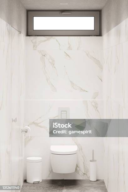 Modern Narrow Bathroom With White Marble Walls Gray Granite Floor Door The Window Above The Toilet Trash Bin Toilet Brush Toilet Paper Front View Stock Photo - Download Image Now