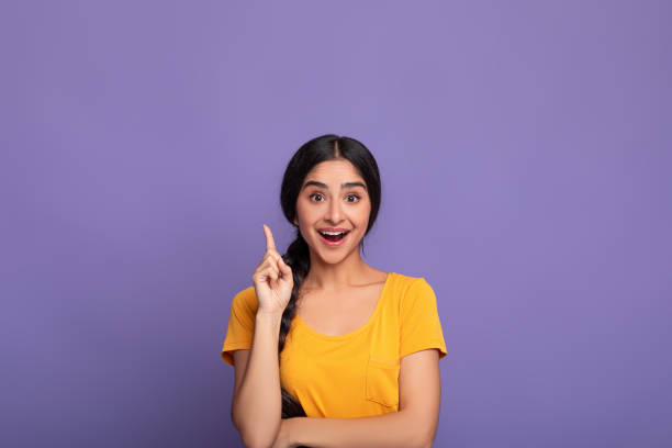 istock Excited indian woman has great idea and points up 1312612682