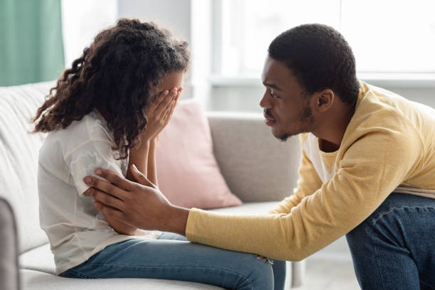istock Black father comforting his crying kid, home interior 1312612740