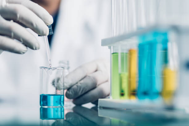 istock Hand of Biochemical research scientist working with science laboratory test tubes for coronavirus vaccine development in pharmaceutical research labolatory. 1312615544