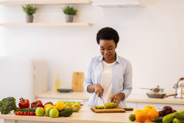 istock Lady Enjoying Cooking Leisure Cutting Vegetables For Salad In Kitchen 1312619428