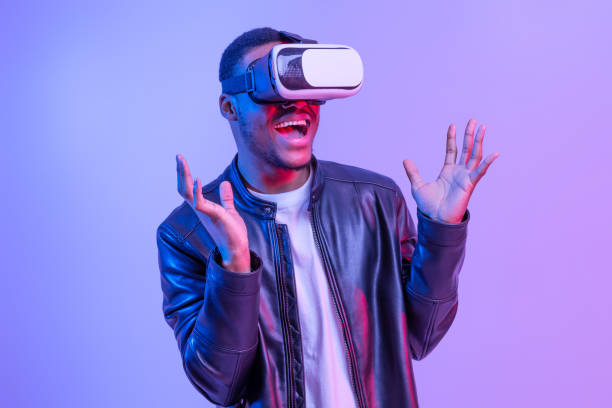 istock Excited African American Guy In VR Glasses Enjoying Virtual Reality Experience 1312619767