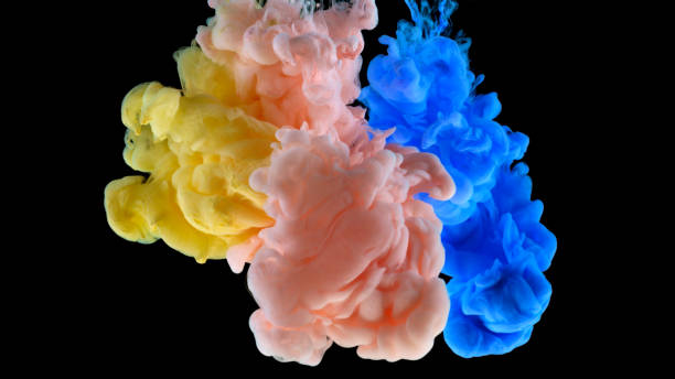istock Close-up of paint dissolving in water 1312620881