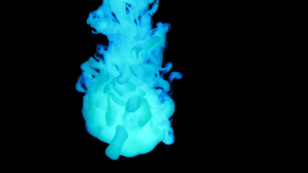 istock Close-up of paint dissolving in water 1312620901