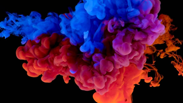 istock Close-up of paint dissolving in water 1312620935