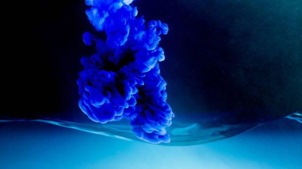 istock Close-up of paints dissolving in water 1312623547