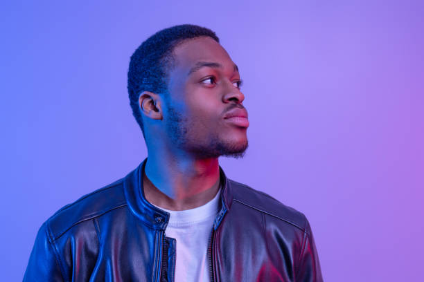 istock Handsome Young African American Man In Stylish Leather Jacket Looking Aside 1312623657
