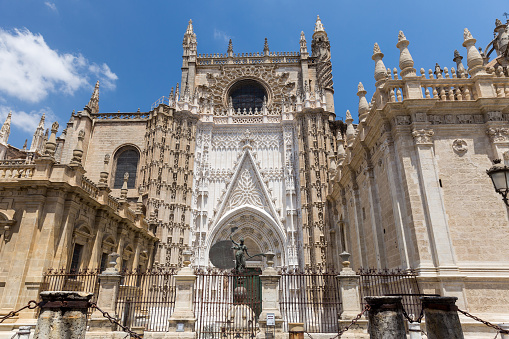 View of the beautiful facade and architecture of the Cathedral of Seville. Roman Catholic cathedral registered in 1987 by UNESCO as a World Heritage SiteThe third-largest church in the world.