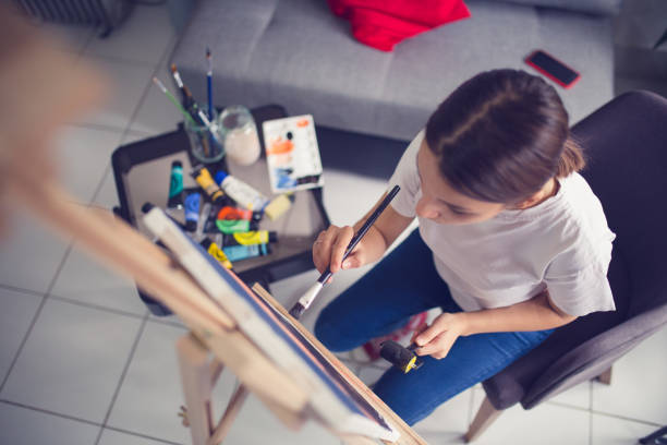 istock Young artist drawing in atelier 1312624088