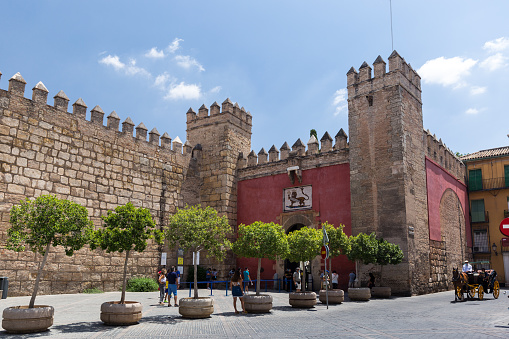 Seville, SPAIN - July 22 2020: Puerta del León in the center of Seville. Is the main entrance to the Alcázar and takes its name from the 19th century.