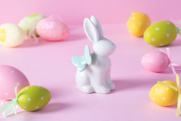 istock Easter bunny and colorful eggs on pink background. Easter concept. Easter greeting card. 1312625094