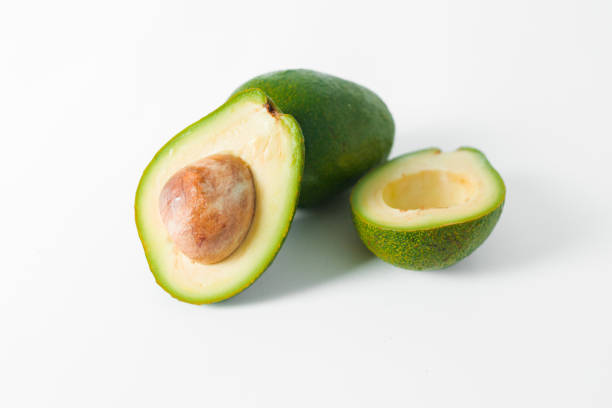 istock Avocado fruit whole and half on white background. Natural food concept. 1312625377