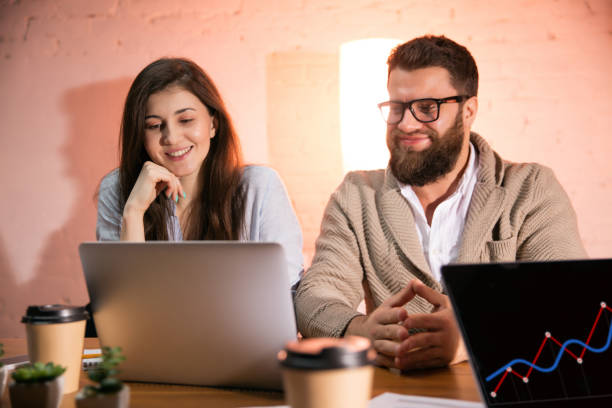 istock Colleagues working together in modern office using devices and gadgets during creative meeting 1312626279