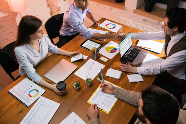 istock Colleagues working together in modern office using devices and gadgets during creative meeting 1312626312